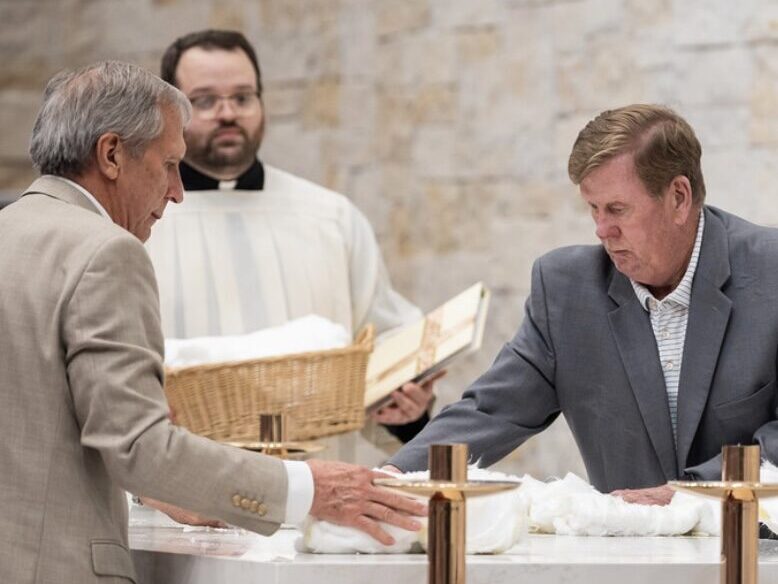 Members of the Men's Club serving at Mass.