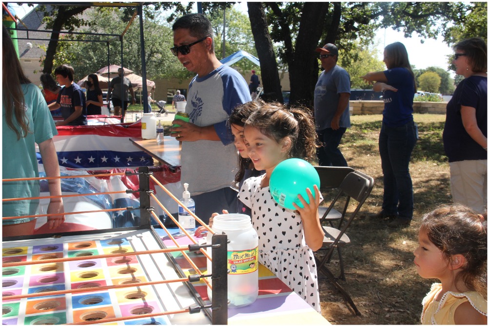 Kids playing midway games