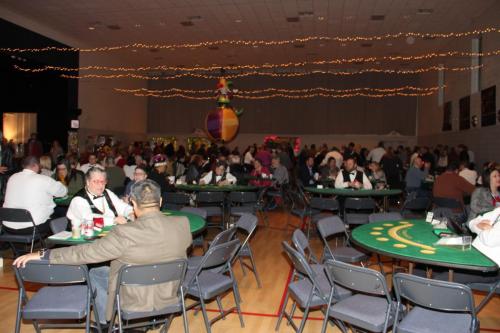 Guests playing table games at the Mardi Gras Casino party. 