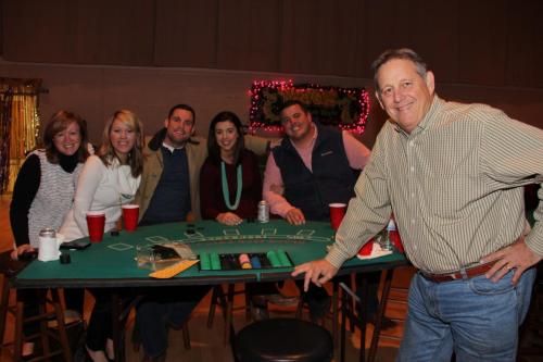 Guests playing table games at the Mardi Gras Casino party. 