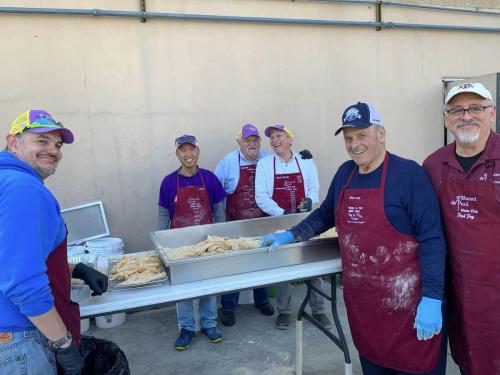 Men's Club Fish Fry fish breading station
